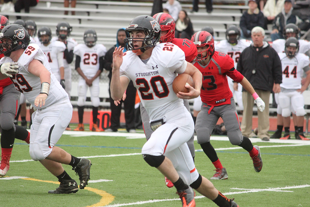 Stoughton junior Ryan Sullivan (95 yards, two touchdowns) carries the ball in the first half against Milford. (Ryan Lanigan/HockomockSports.com)