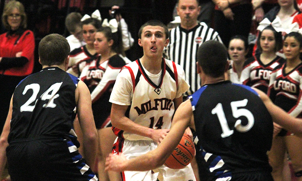 Milford's Zack Tamagni draws a double team in the second half against Hopedale. (Ryan Lanigan/HockomockSports.com)