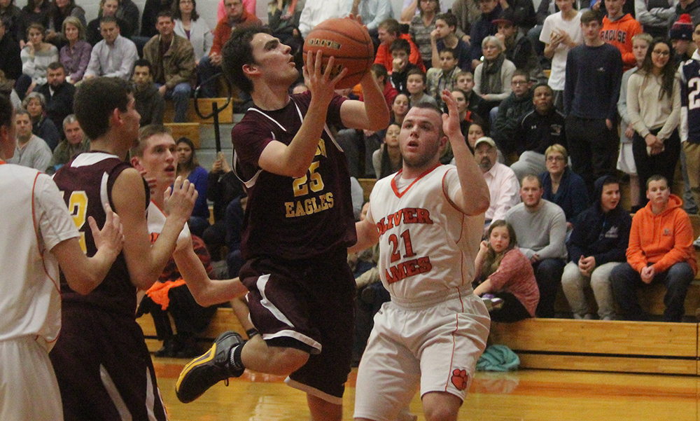 Sharon's Matt Lowerre drives to the basket in the first half against Oliver Ames. (Ryan Lanigan/HockomockSports.com)